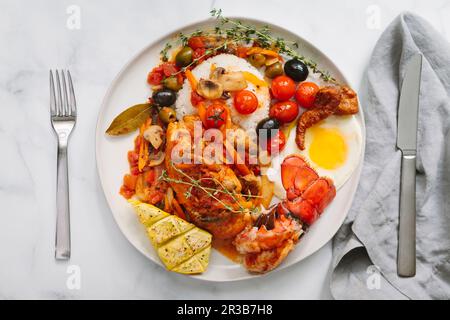Chicken Marengo plated with squash Stock Photo