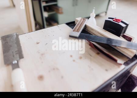 Carpentry hand tools on workbench in factory Stock Photo