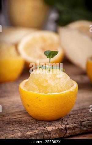 Refreshing melon and lemon granita served in a hollowed out lemon half Stock Photo
