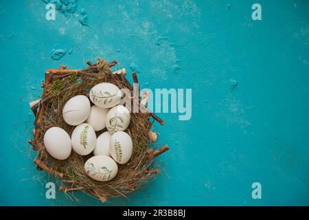 Painted Easter eggs in an Easter basket Stock Photo