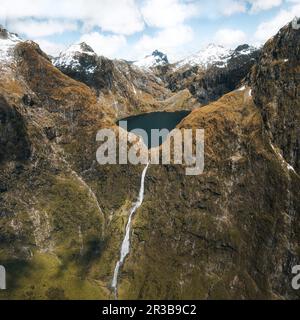 Amazing aerial view of mountain Lake Quill and Sutherland Falls on the scenic flight from Milford Sound to Queenstown, Fiordland, New Zealand Stock Photo