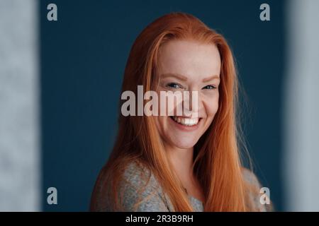Portrait of cheerful redhead woman Stock Photo