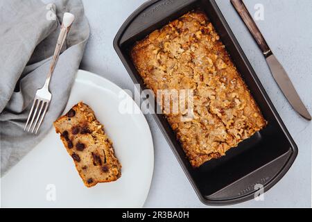 Freshly baked chocolate chip banana bread loaf topped with walnuts Stock Photo