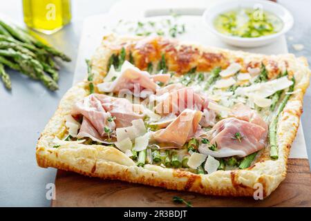 Asparagus, parmesan and proscuitto puff pastry tart Stock Photo