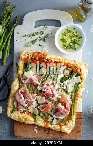 Asparagus, parmesan and proscuitto puff pastry tart Stock Photo