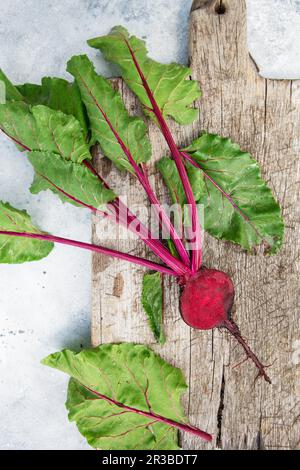 Fresh beetroot with leaves on a wooden board. Healthy food. Beetroots. Organic beet, beetroot on gre Stock Photo