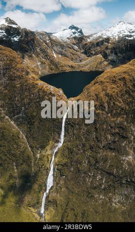 Amazing aerial view of mountain Lake Quill and Sutherland Falls on the scenic flight from Milford Sound to Queenstown, Fiordland, New Zealand Stock Photo