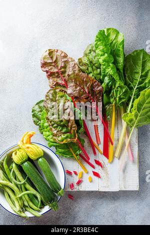 Rainbow chard, courgettes and beans from the garden Stock Photo