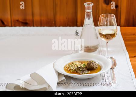 Beef soup with three layers - fries, liver dumplings, liver slices Stock Photo