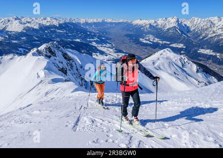 Austria, Tyrol, Skiers on snowcapped top of Kellerjoch mountain Stock Photo