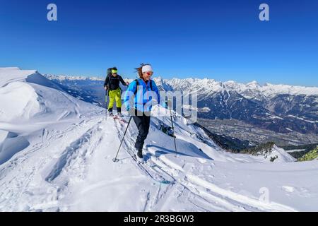Austria, Tyrol, Skiers on snowcapped top of Kellerjoch mountain Stock Photo