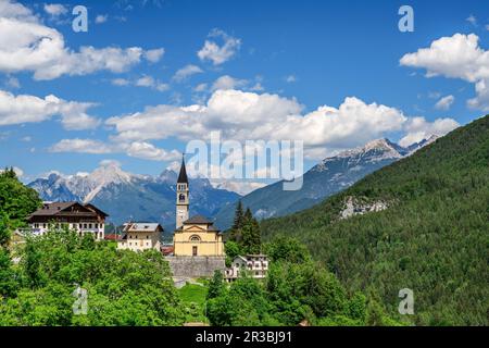 Italy, Veneto, Cibiana di Cadore, Summer clouds over village in Dolomites Stock Photo