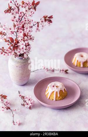 Mini Easter cakes with pink icing Stock Photo