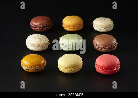 Colorful macaron cookies arranged in shape of emoji smile Stock Photo