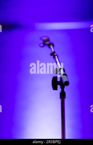 Microphone on a stand on an empty stage Stock Photo - Alamy