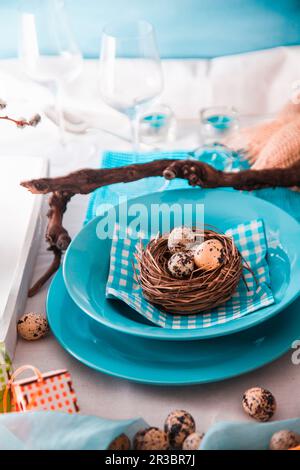 Easter table setting with quail eggs Stock Photo