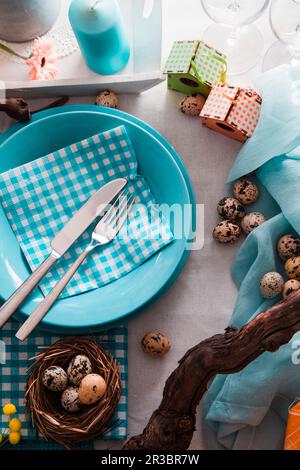 Easter table setting with quail eggs Stock Photo