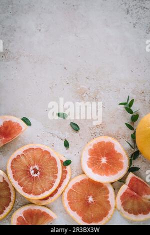 Sliced blood grapefruit on bright surface Stock Photo