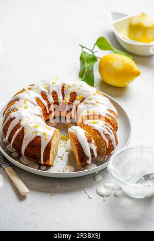 Lemon drizzle bundt cake with lemon icing Stock Photo