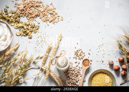 Cereals, seeds, groats, nuts, pumpkin seeds, yoghurt and milk Stock Photo