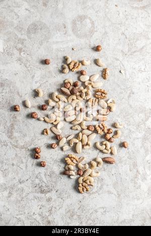 Mixed Nuts on a gray background Stock Photo