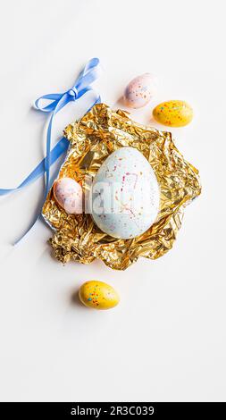 Pastel coloured chocolate Easter eggs Stock Photo