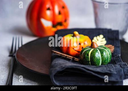 Place setting for Thanksgiving festive dinner decorated with pumpkins Stock Photo