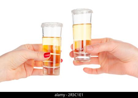 Two hands clinking glasses with shot cocktail isolated on white Stock Photo