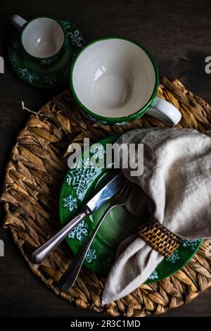 Holiday Christmas dinner place setting on wooden vintage table Stock Photo