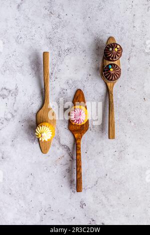 Mini cupcakes on wooden cake lifters Stock Photo