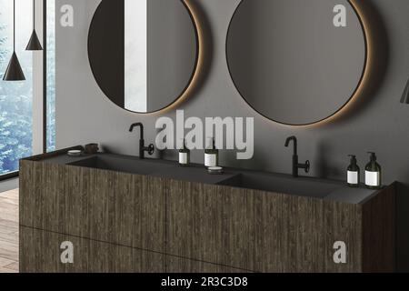 Corner of modern bathroom with gray walls, wooden floor, double sink and two round mirrors. Window with blurry view. 3d rendering Stock Photo