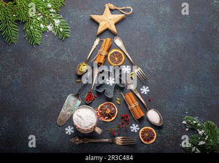 Christmas baking composition made in shape of Christmas fir tree from kitchen tools and cooking ingredients Stock Photo