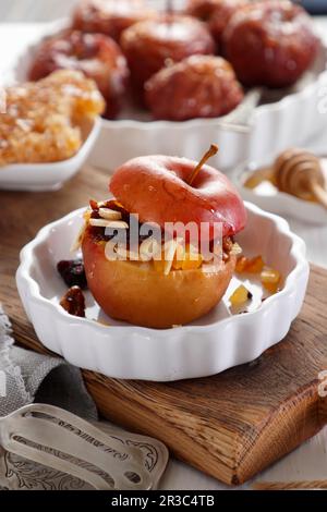 Baked apple stuffed with dried fruits and nuts Stock Photo