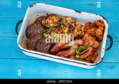 Grilled burgers, chicken, pork and sausages Stock Photo