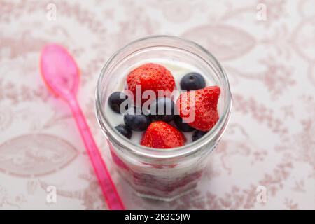Yoghurt with granola, strawberries, raspberries and blueberries Stock Photo