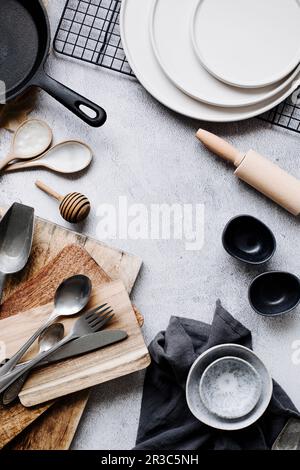 Baking utensils, cutlery, and plates Stock Photo