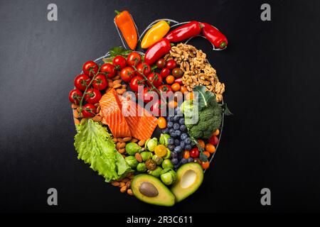 Fruit and vegetables arrangement in realistic heart shape Stock Photo