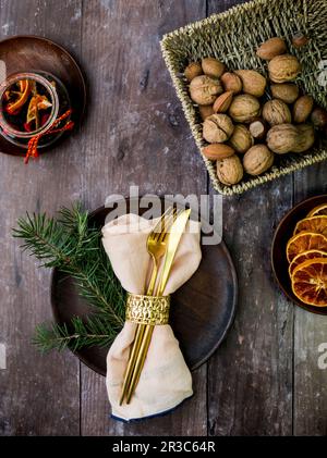 Christmas table setting on rustic wooden table Stock Photo
