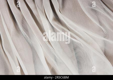 Chiffon tulle fabric textured background. pleated skirt fabric texture. closeup plisse fabric textur Stock Photo