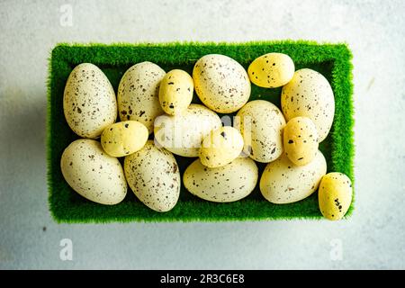 Easter concept with basket with green grass full of eggs Stock Photo
