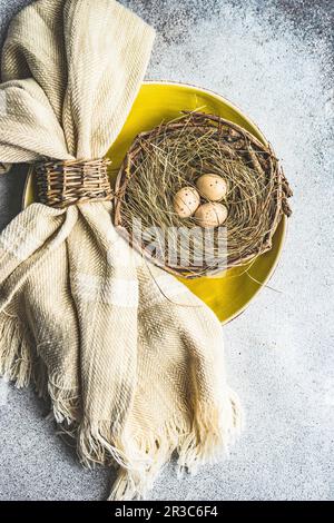 Easter minimalistic place setting on concrete background Stock Photo