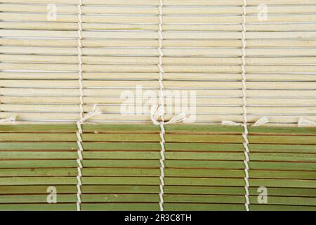 Green Bamboo mat. Traditional green bamboo pad texture. sushi matt background abstract texture. Macr Stock Photo