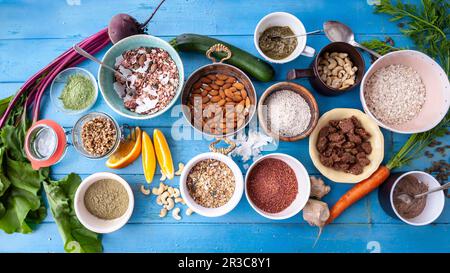 Bowl of Cold Cereal; Nuts, Milk and Apple Stock Photo