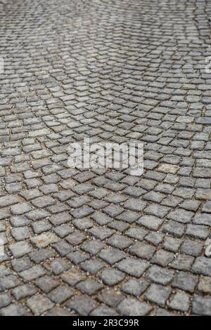Stone paving texture. Abstract structured background. Grey bouldering with granite cobblestones as b Stock Photo