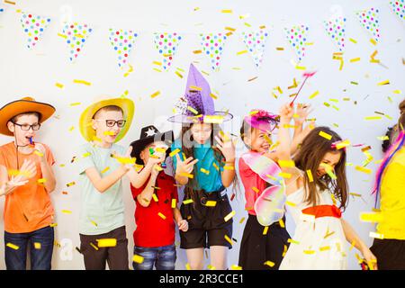 Kid's Birthday party with party horns and confetti Stock Photo