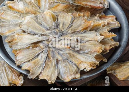 Raw dried salted Sepat fish or Malay called Ikan Sepat Kering is a famous dish in Malaysia Stock Photo