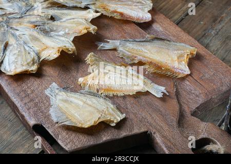 Raw dried salted Sepat fish or Malay called Ikan Sepat Kering is a famous dish in Malaysia Stock Photo