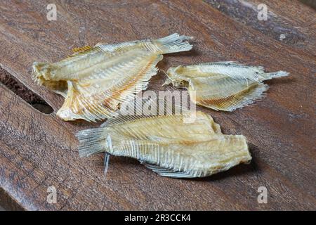 Raw dried salted Sepat fish or Malay called Ikan Sepat Kering is a famous dish in Malaysia Stock Photo