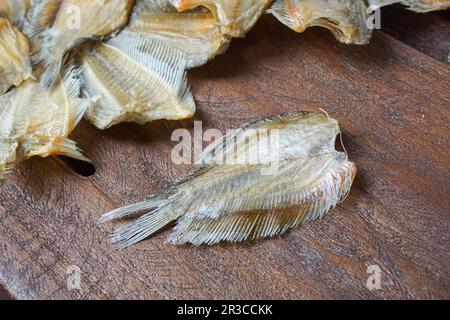 Raw dried salted Sepat fish or Malay called Ikan Sepat Kering is a famous dish in Malaysia Stock Photo