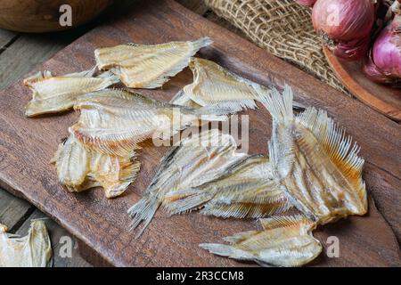 Raw dried salted Sepat fish or Malay called Ikan Sepat Kering is a famous dish in Malaysia Stock Photo